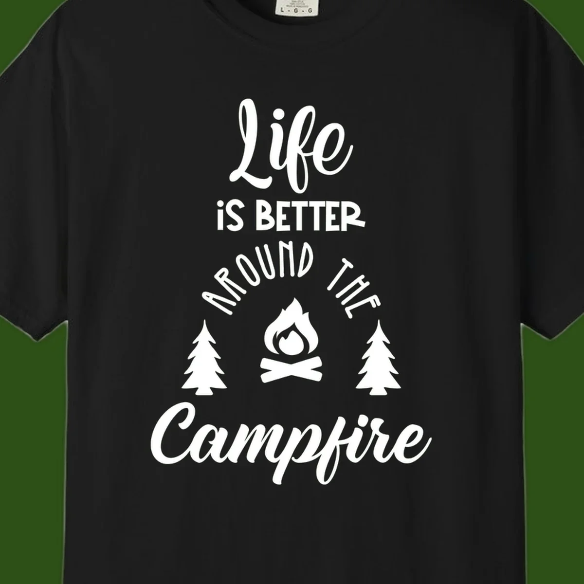 White lettering and campfire graphic with pine trees on gray background reading 'Life is better around the campfire'