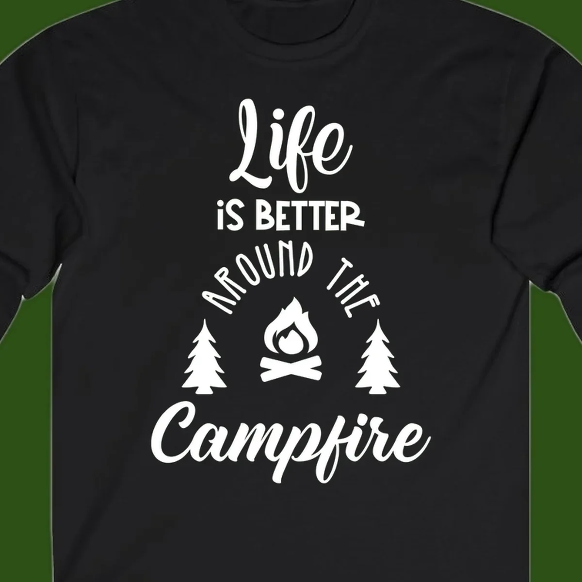 White lettering and campfire graphic with pine trees on gray background reading 'Life is better around the campfire'
