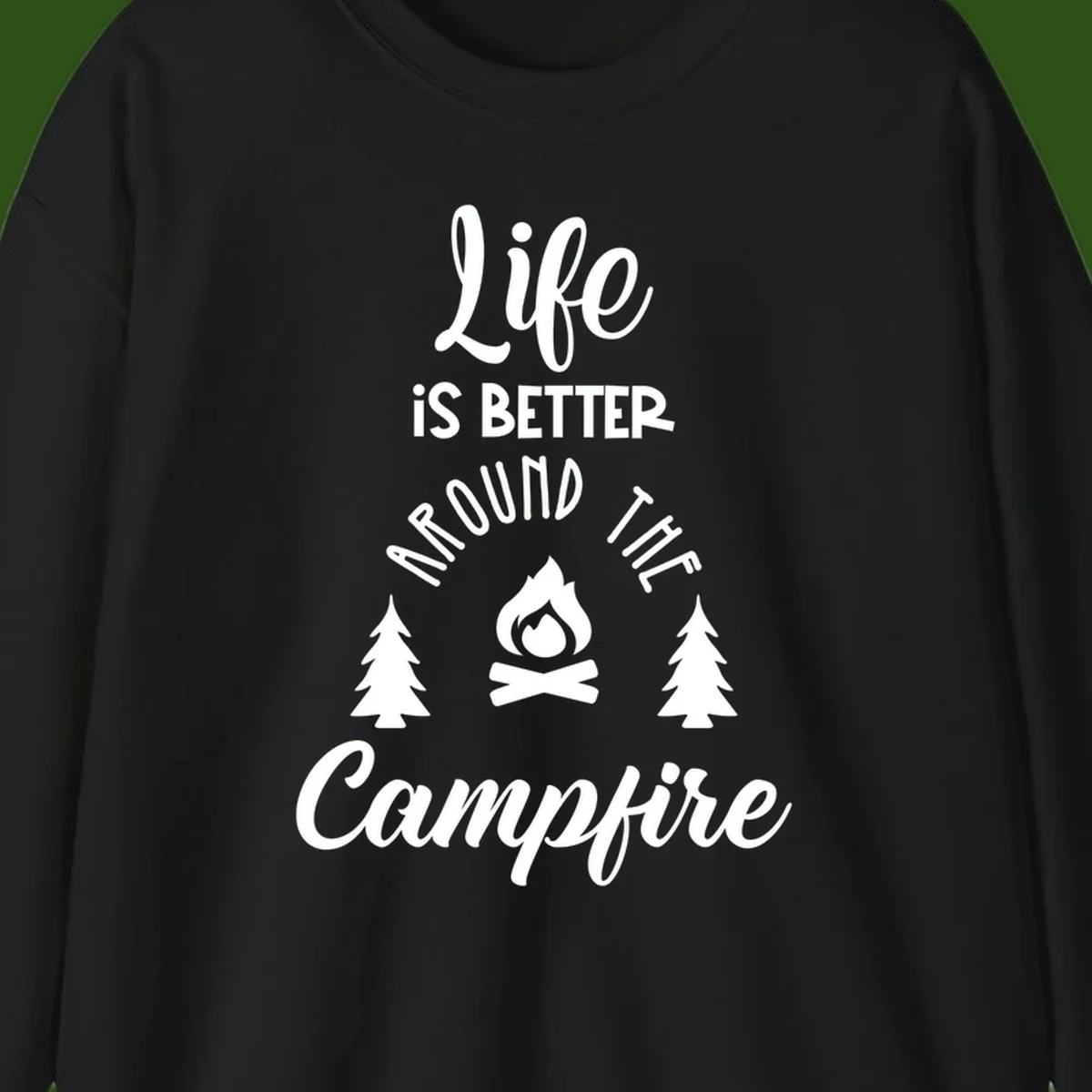 White lettering and campfire graphic with pine trees on gray background reading 'Life is better around the campfire'