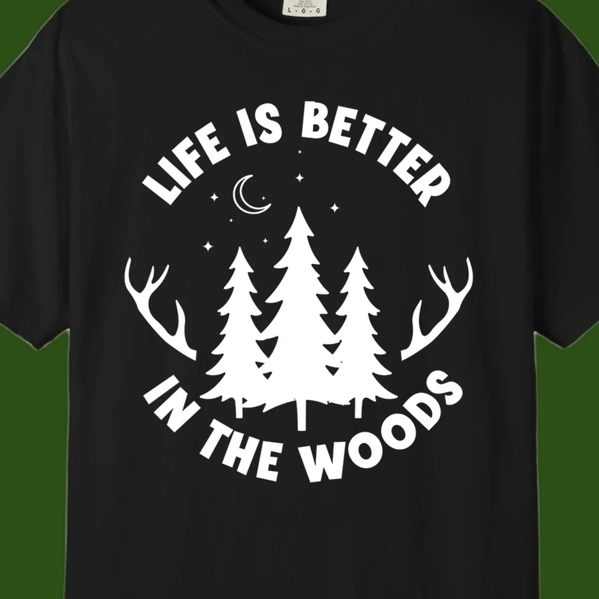 Life is better in the woods design with pine trees, deer antlers, moon and stars on gray background