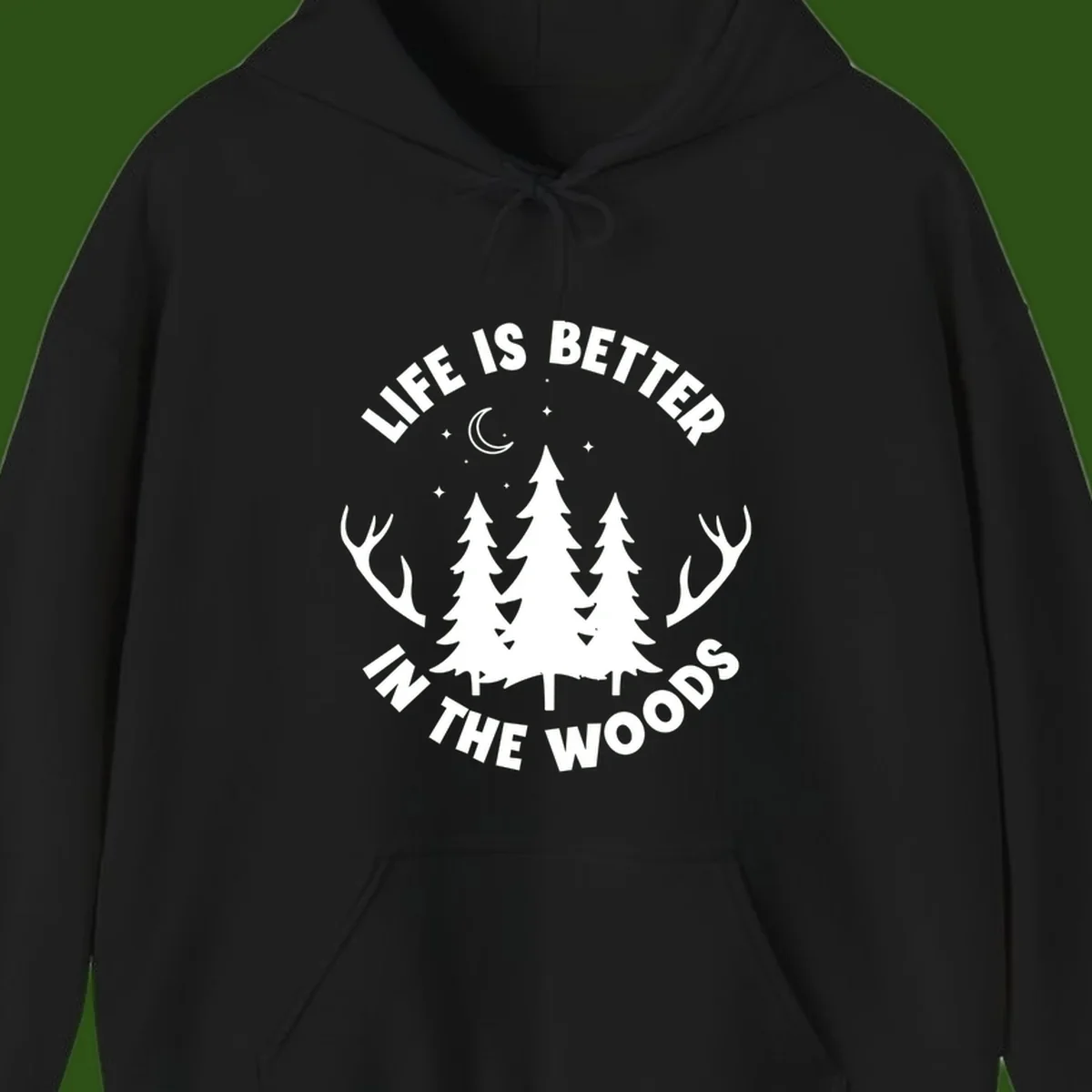 Life is better in the woods design with pine trees, deer antlers, moon and stars on gray background