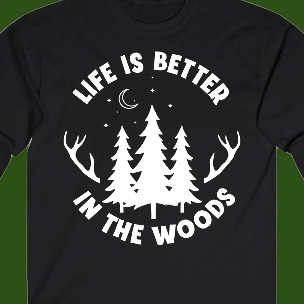 Life is better in the woods design with pine trees, deer antlers, moon and stars on gray background