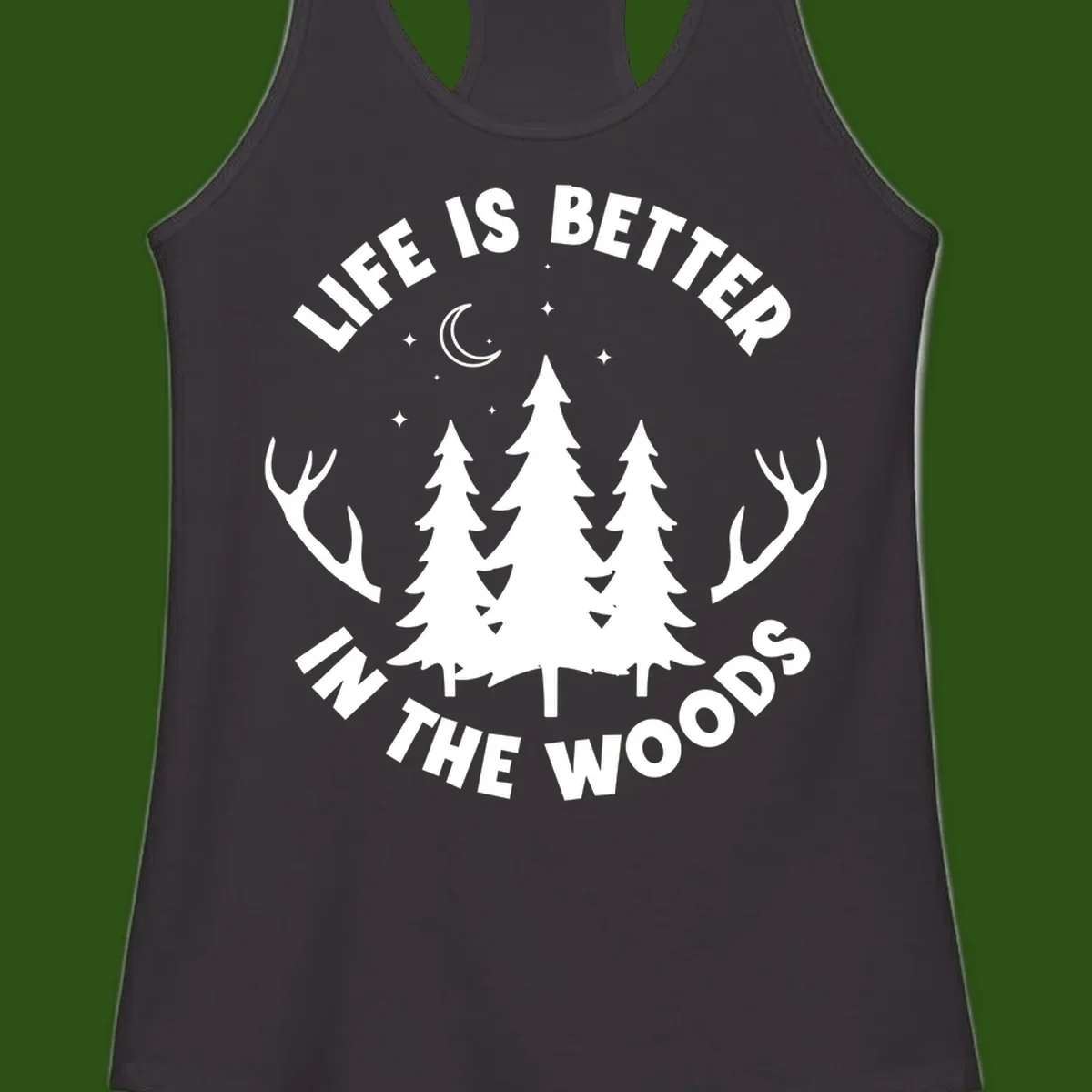 Life is better in the woods design with pine trees, deer antlers, moon and stars on gray background