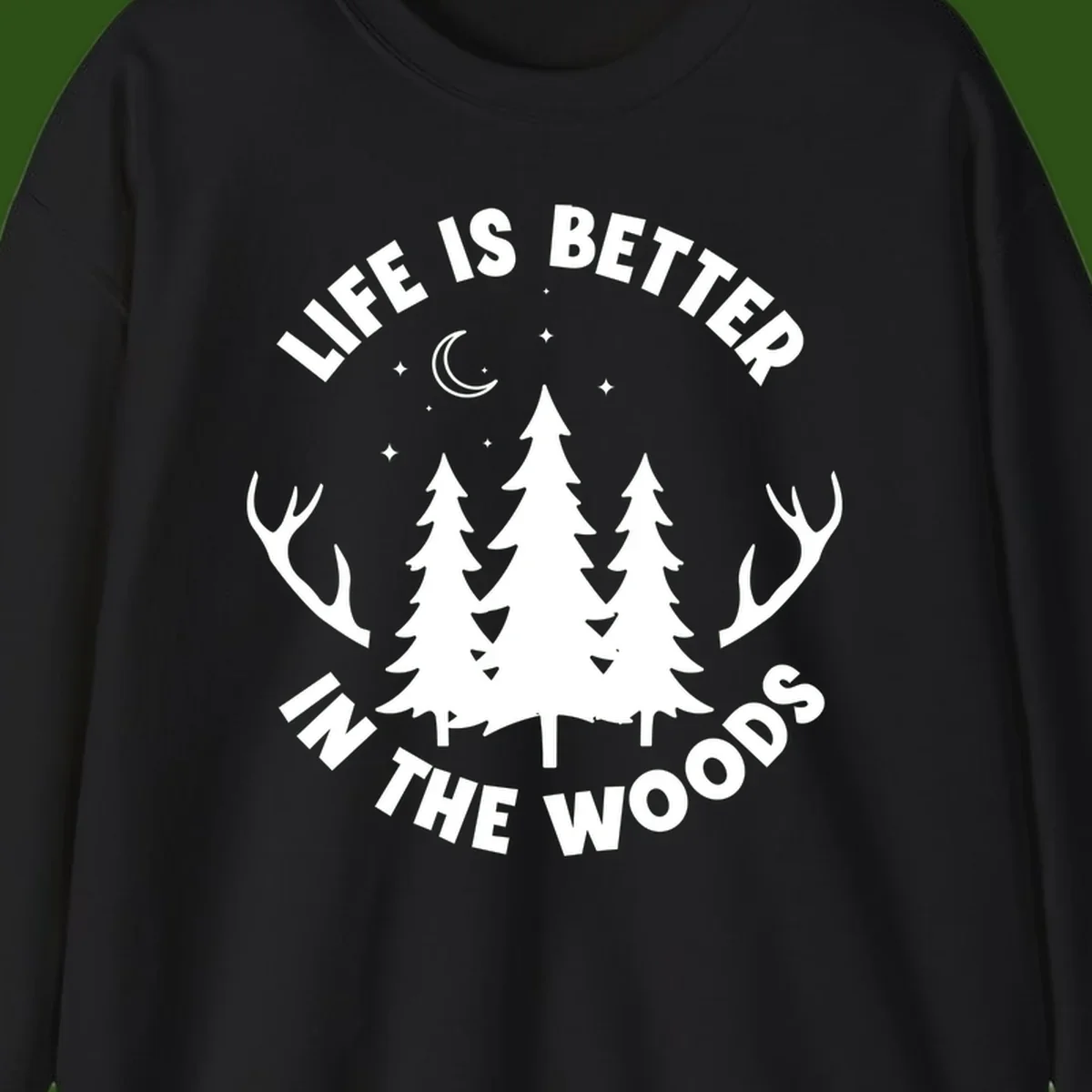Life is better in the woods design with pine trees, deer antlers, moon and stars on gray background