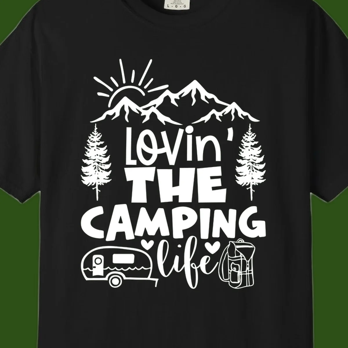 Lovin camping life design with mountains, sun, trees, RV and backpack on gray background