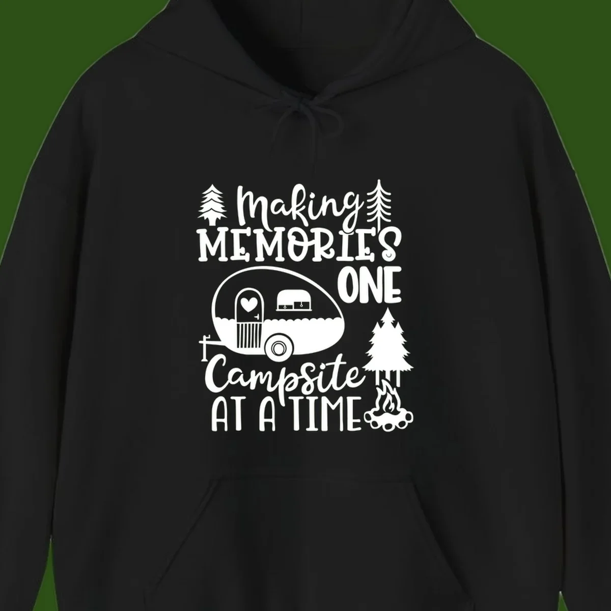 Vintage camper trailer surrounded by pine trees and campfire with 'Making Memories One Campsite At A Time' text