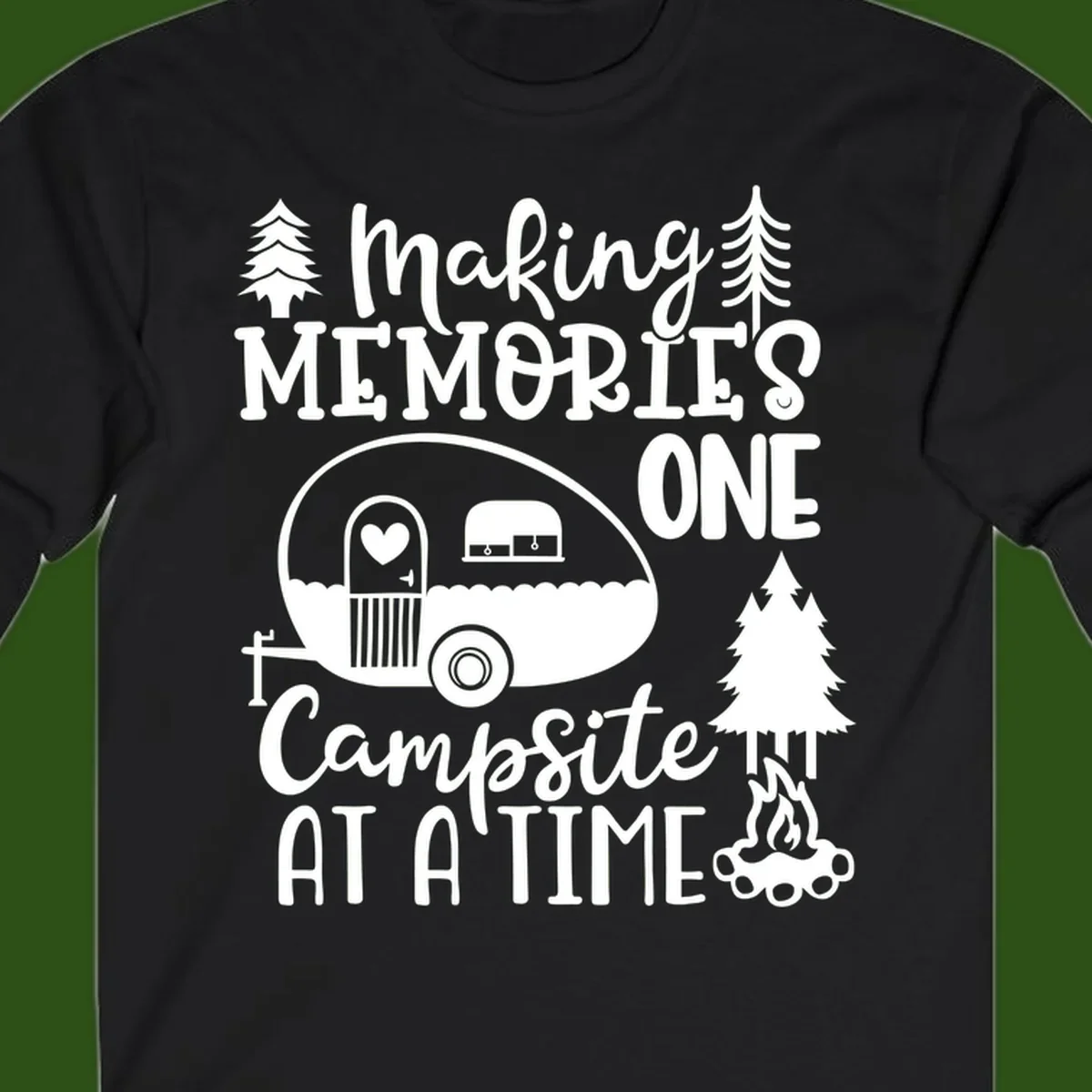 Vintage camper trailer surrounded by pine trees and campfire with 'Making Memories One Campsite At A Time' text