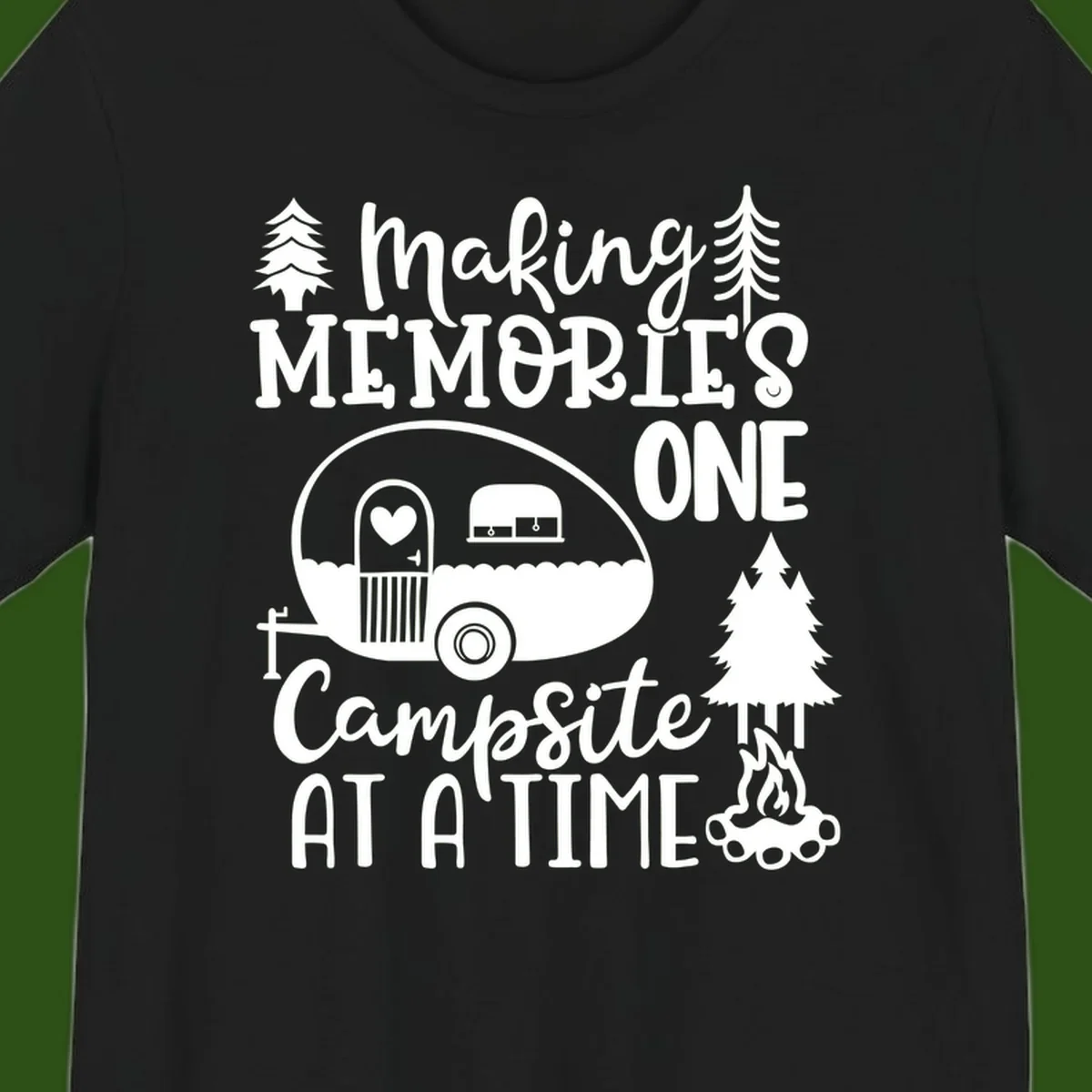 Vintage camper trailer surrounded by pine trees and campfire with 'Making Memories One Campsite At A Time' text