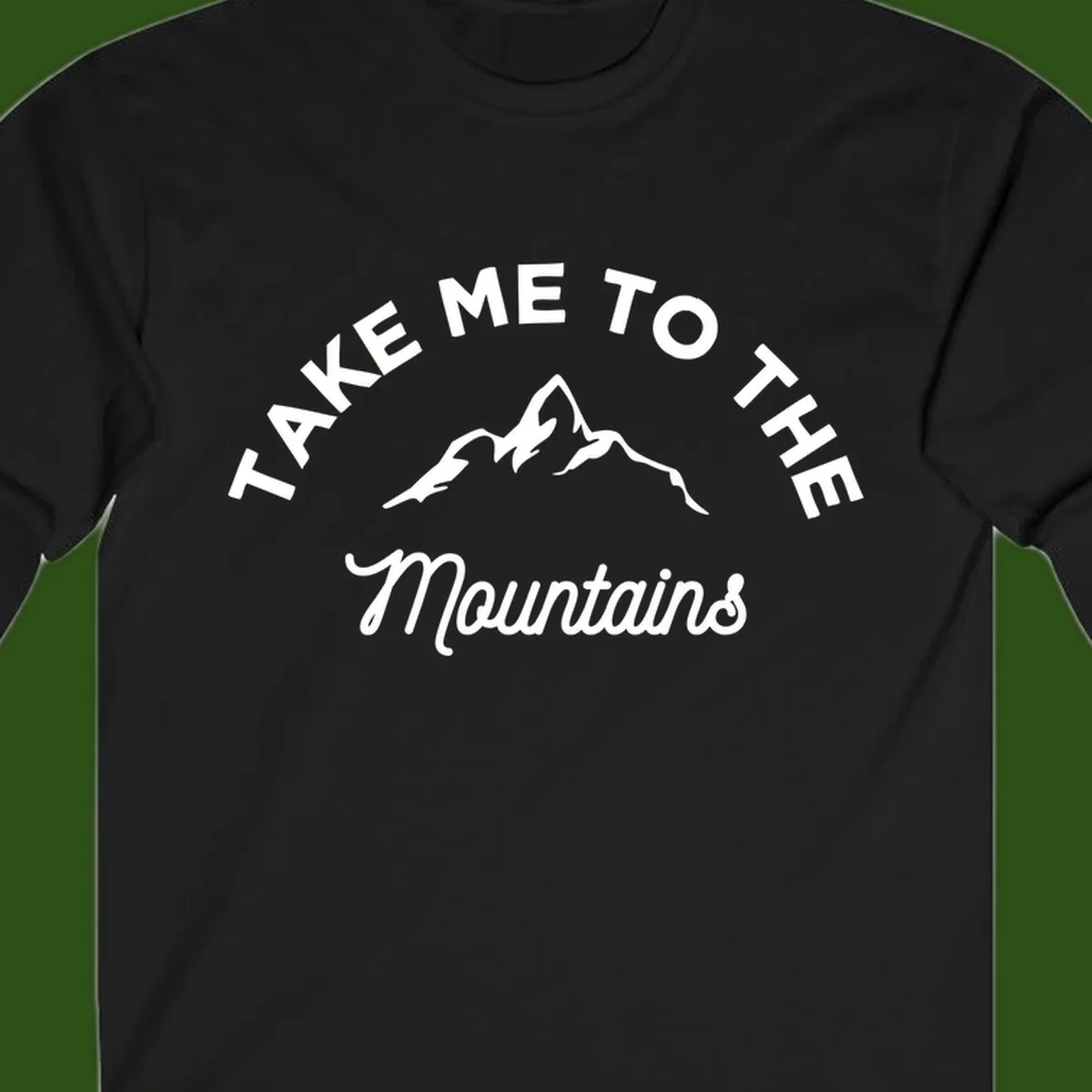White mountain silhouette with curved text reading 'Take Me To The Mountains' on gray background