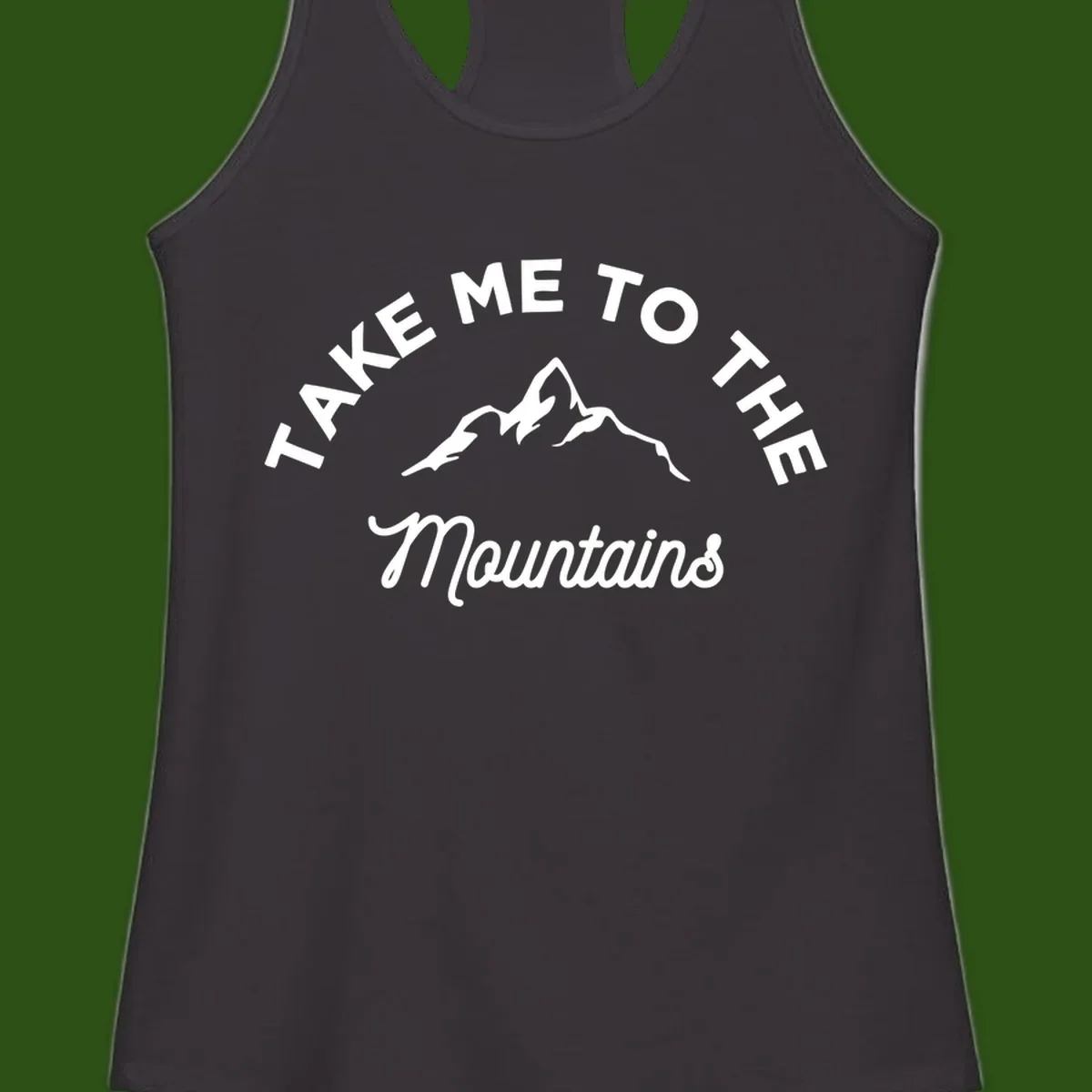White mountain silhouette with curved text reading 'Take Me To The Mountains' on gray background