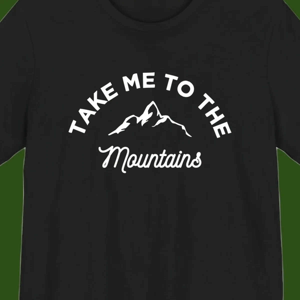White mountain silhouette with curved text reading 'Take Me To The Mountains' on gray background