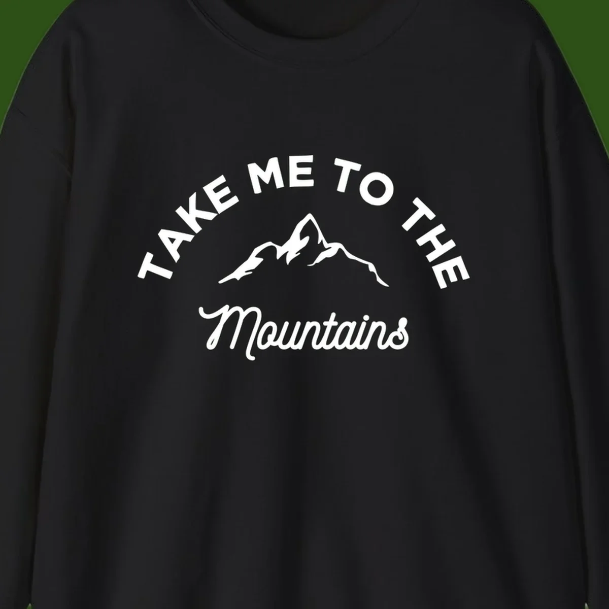 White mountain silhouette with curved text reading 'Take Me To The Mountains' on gray background