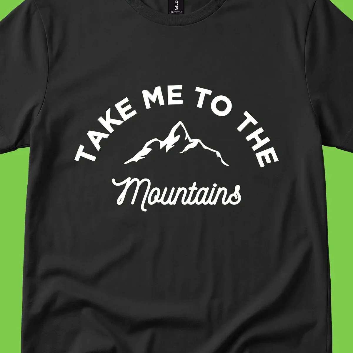 White mountain silhouette with curved text reading 'Take Me To The Mountains' on gray background