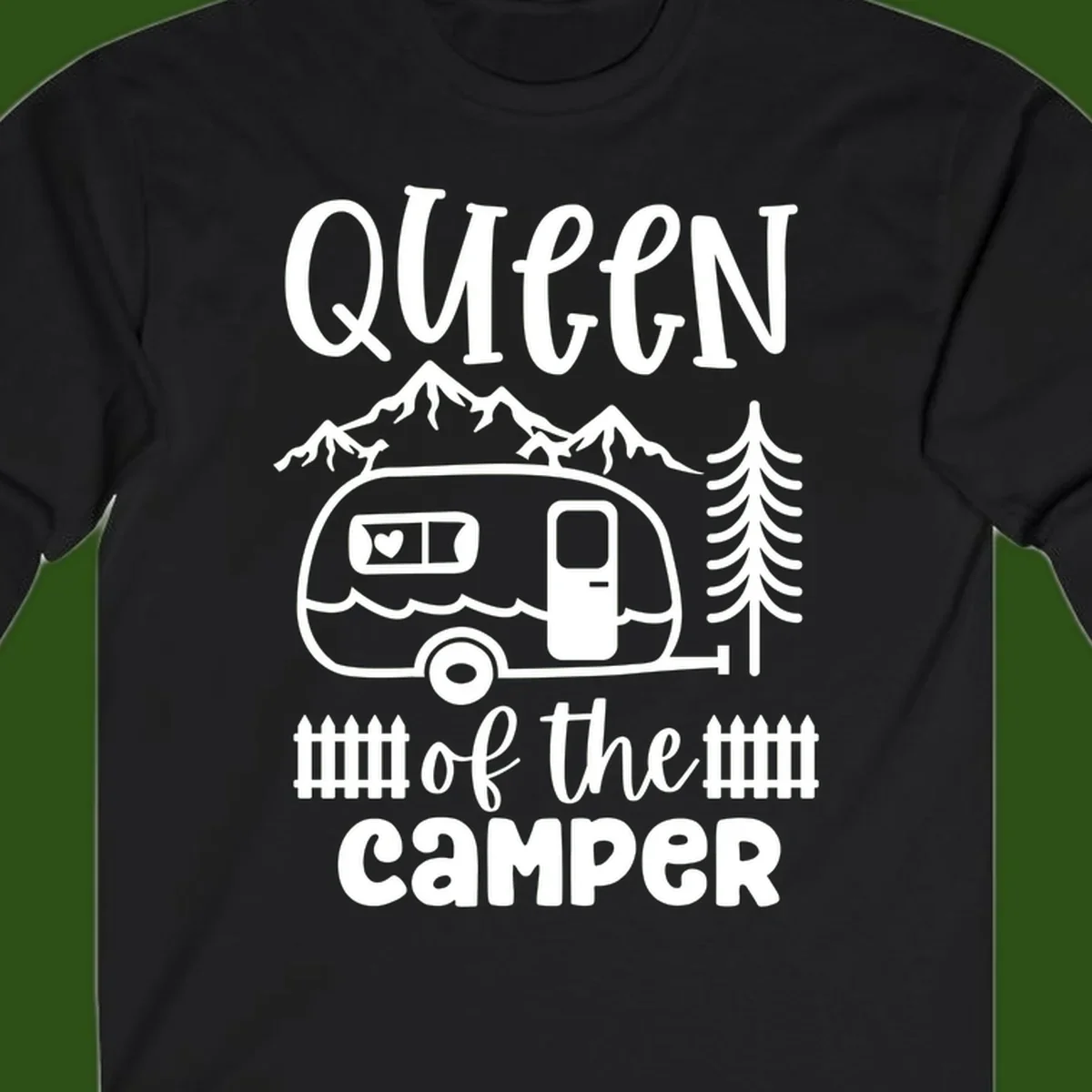 Queen of the Camper design featuring vintage trailer, mountains, and evergreen trees with bold text
