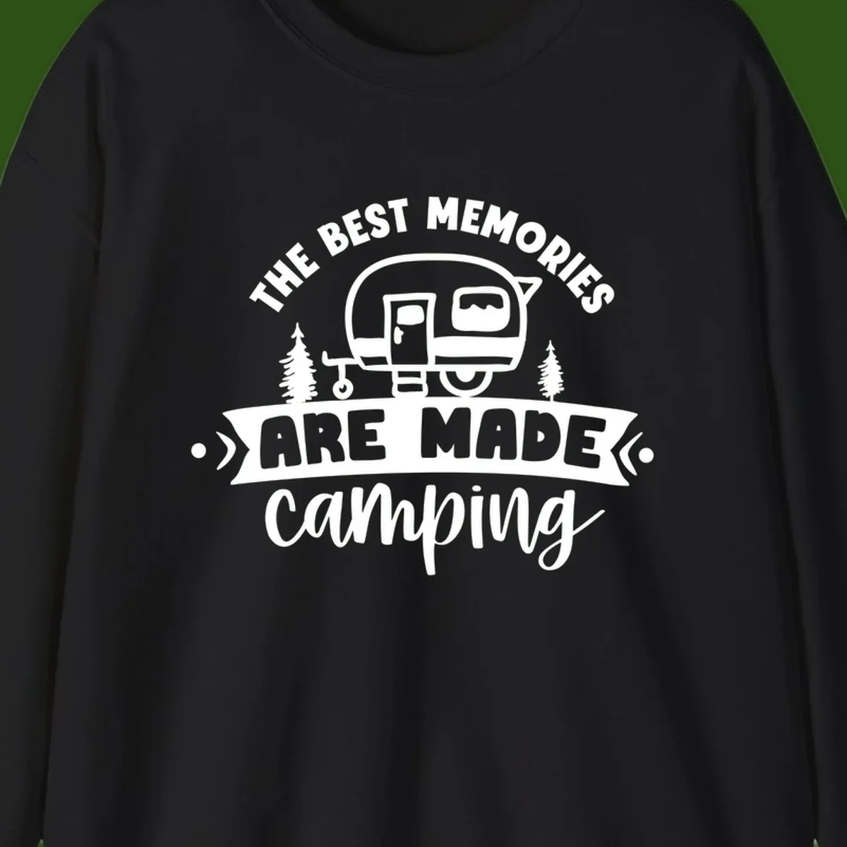 Vintage badge design with classic travel trailer, pine trees, and text reading 'The Best Memories Are Made Camping' in retro style.
