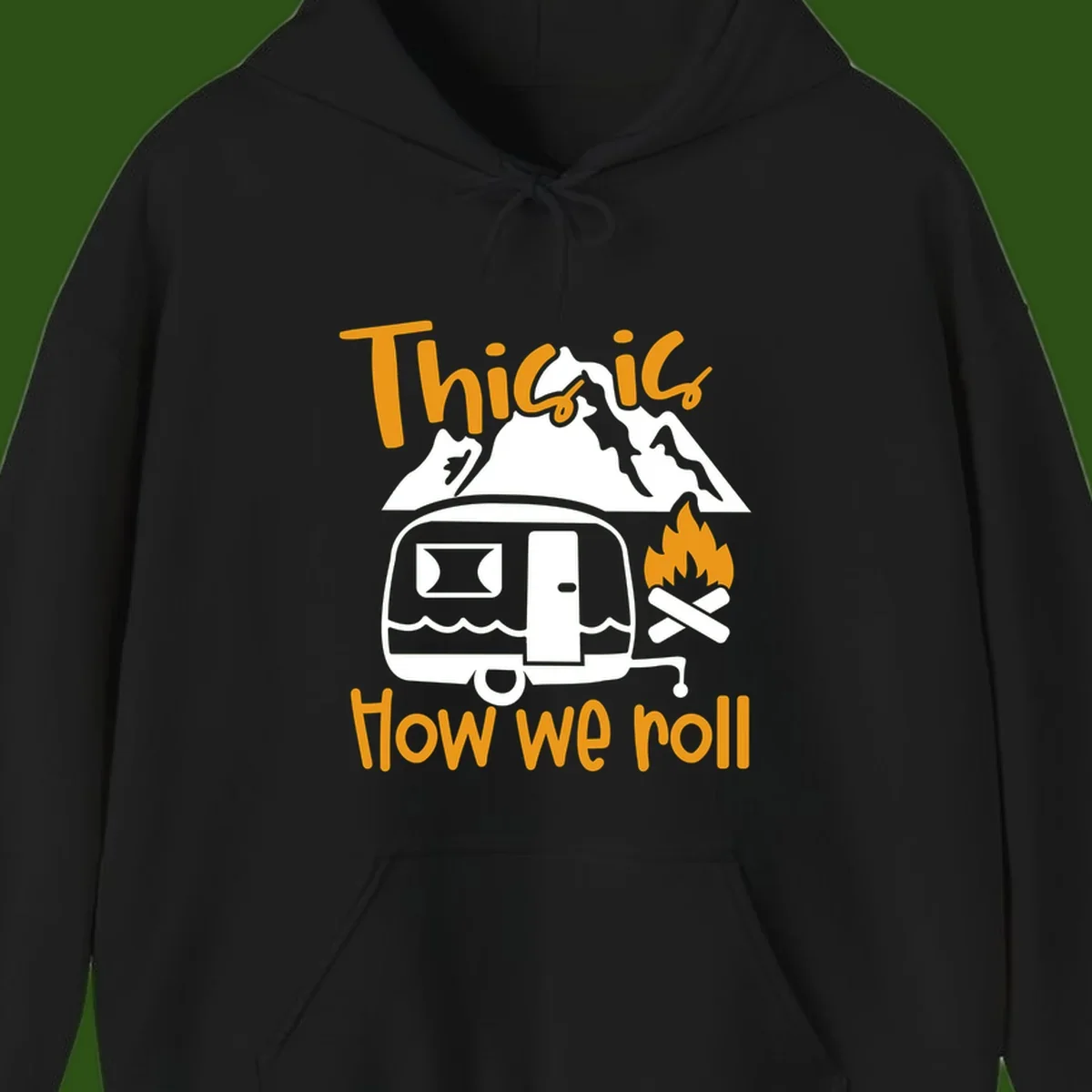 Vintage travel trailer with campfire and mountains, text reads 'This is how we roll' - camping lifestyle illustration