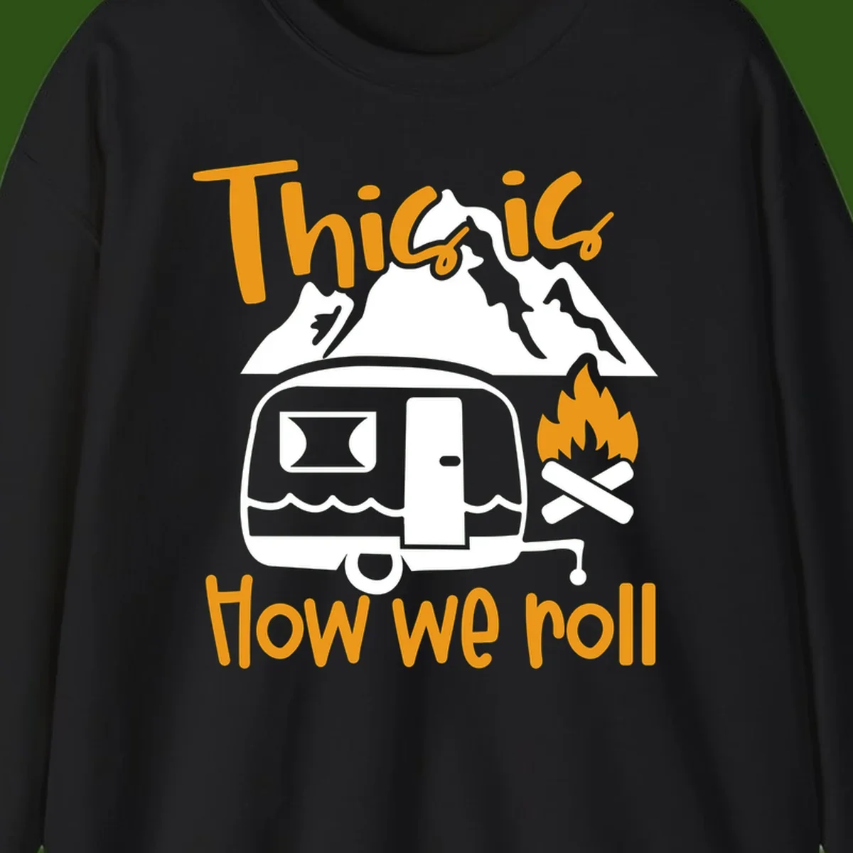 Vintage travel trailer with campfire and mountains, text reads 'This is how we roll' - camping lifestyle illustration