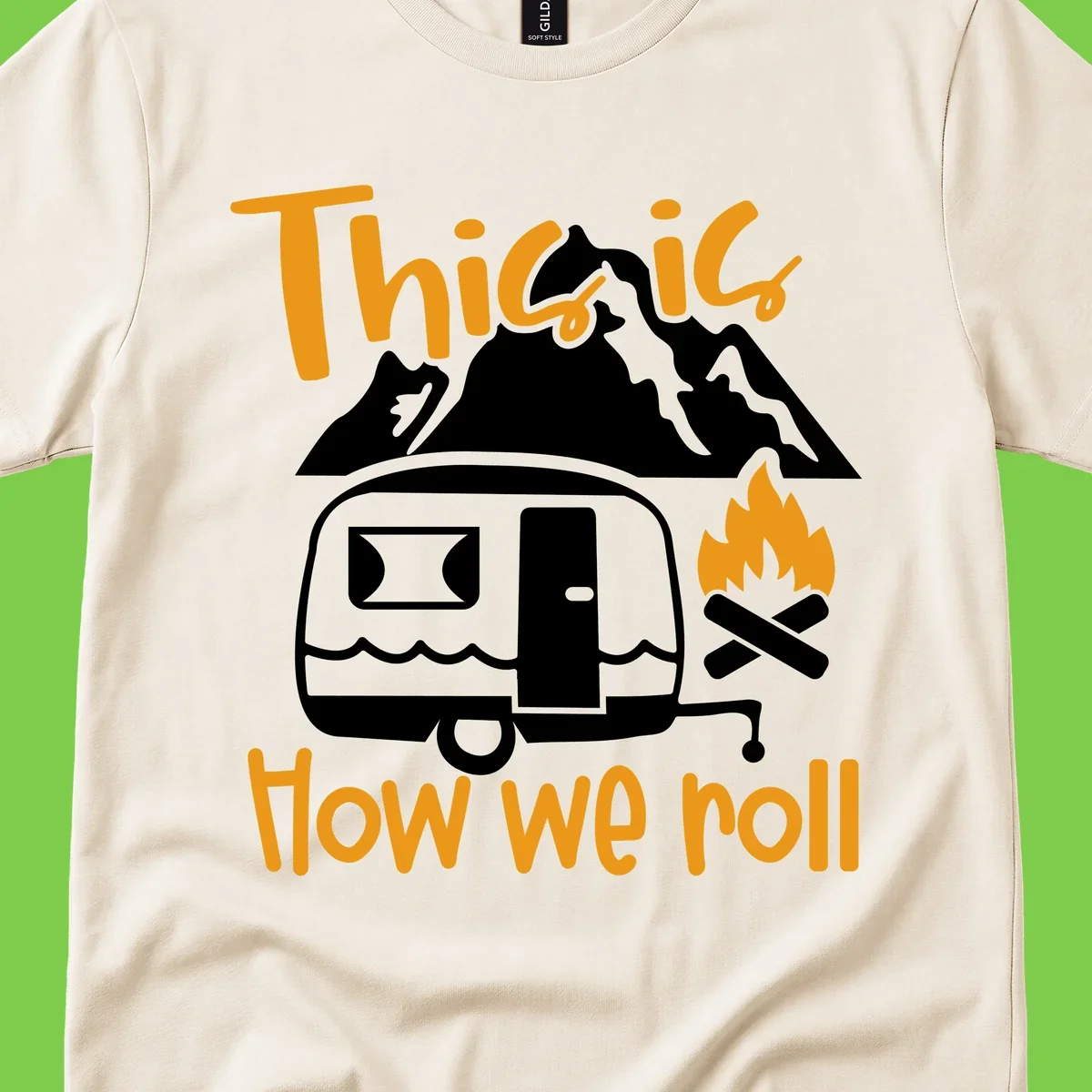 Vintage travel trailer with campfire and mountains, text reads 'This is how we roll' - camping lifestyle illustration