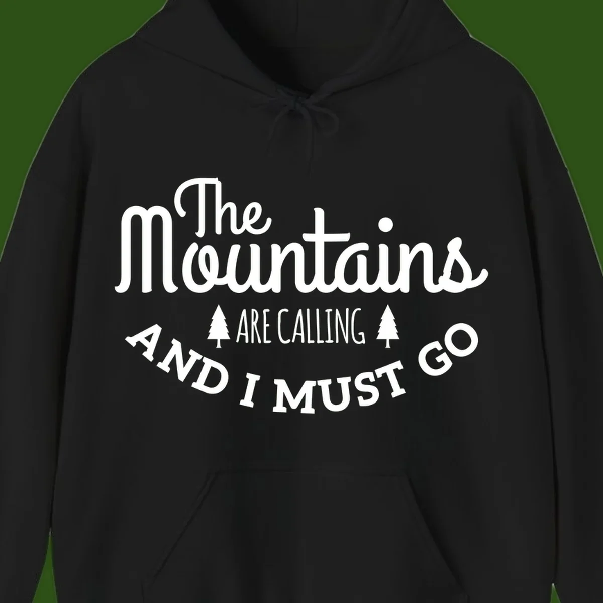 White text reading "The Mountains Are Calling And I Must Go" with pine trees on gray background
