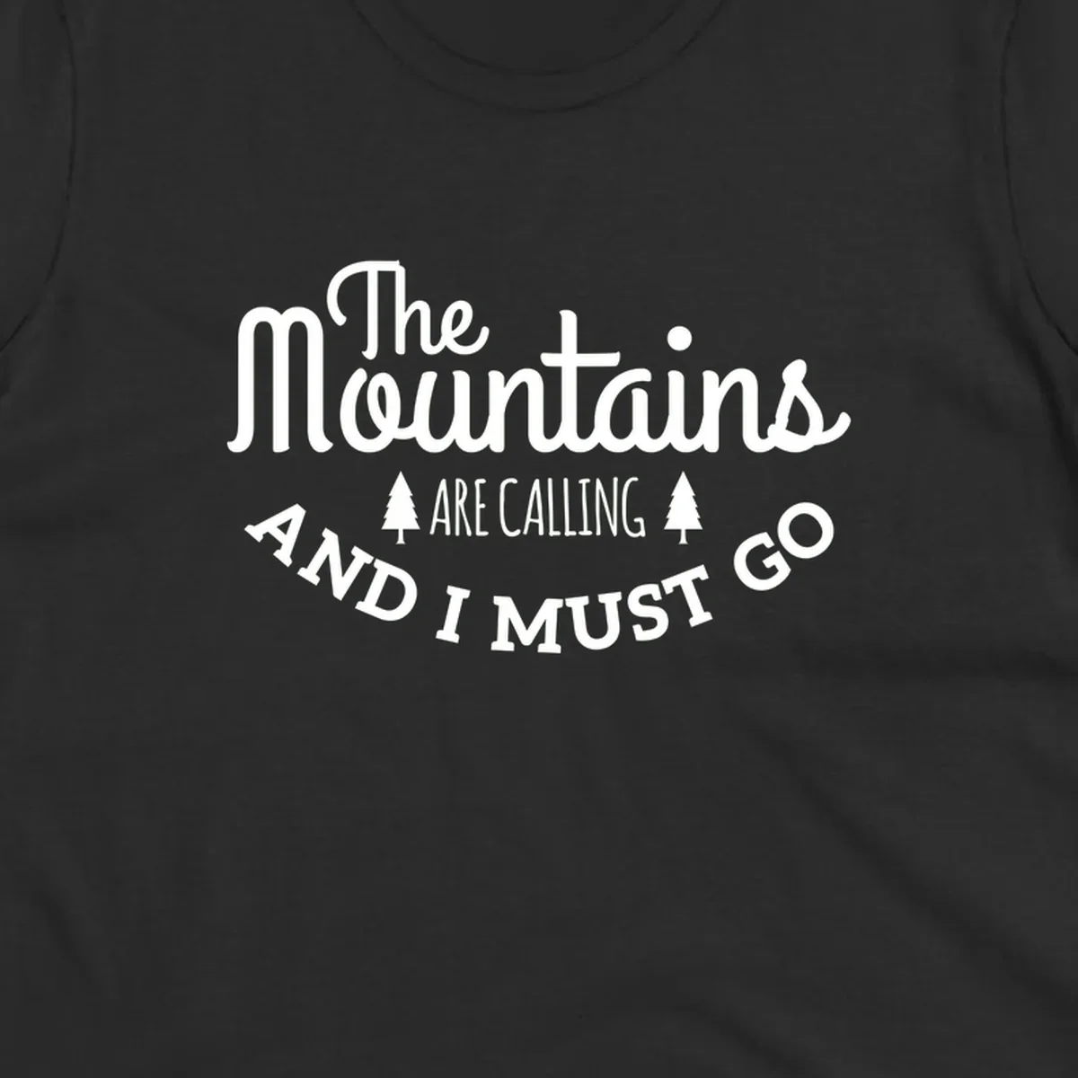 White text reading "The Mountains Are Calling And I Must Go" with pine trees on gray background