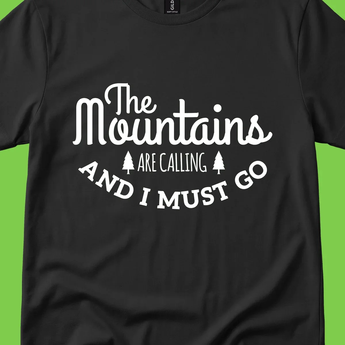 White text reading "The Mountains Are Calling And I Must Go" with pine trees on gray background