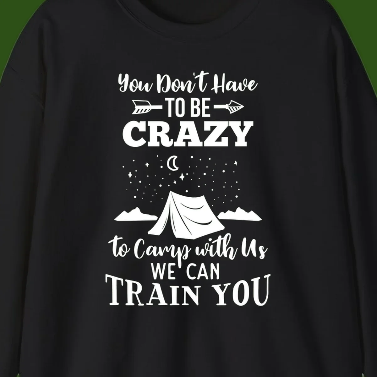 Gray design with white text reading 'You Don't Have To Be Crazy To Camp With Us We Can Train You' featuring a tent under stars and mountains