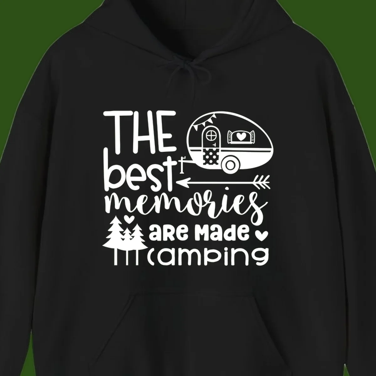 Vintage travel trailer with decorative text reading 'The best memories are made camping' surrounded by pine trees and hearts on gray background.