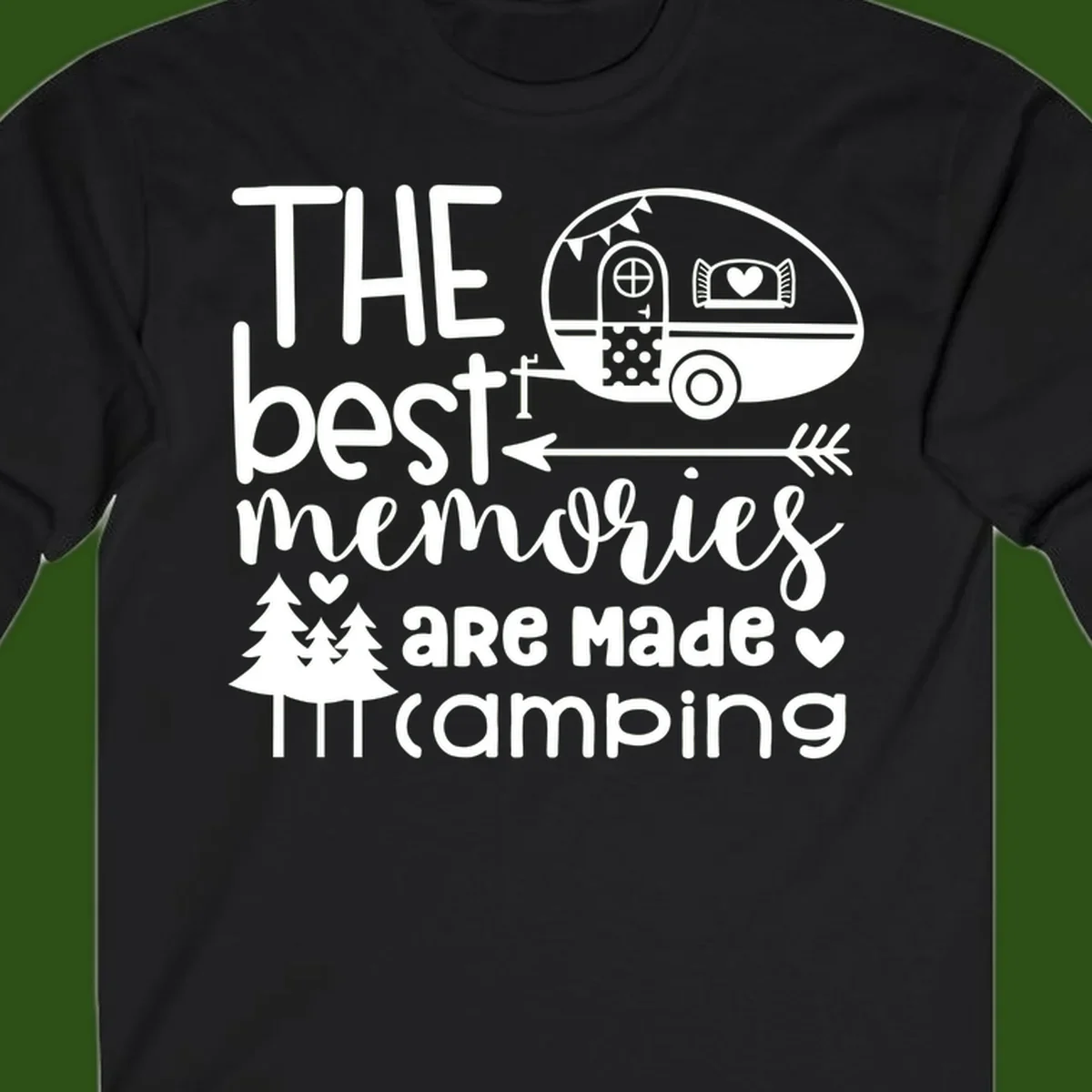 Vintage travel trailer with decorative text reading 'The best memories are made camping' surrounded by pine trees and hearts on gray background.