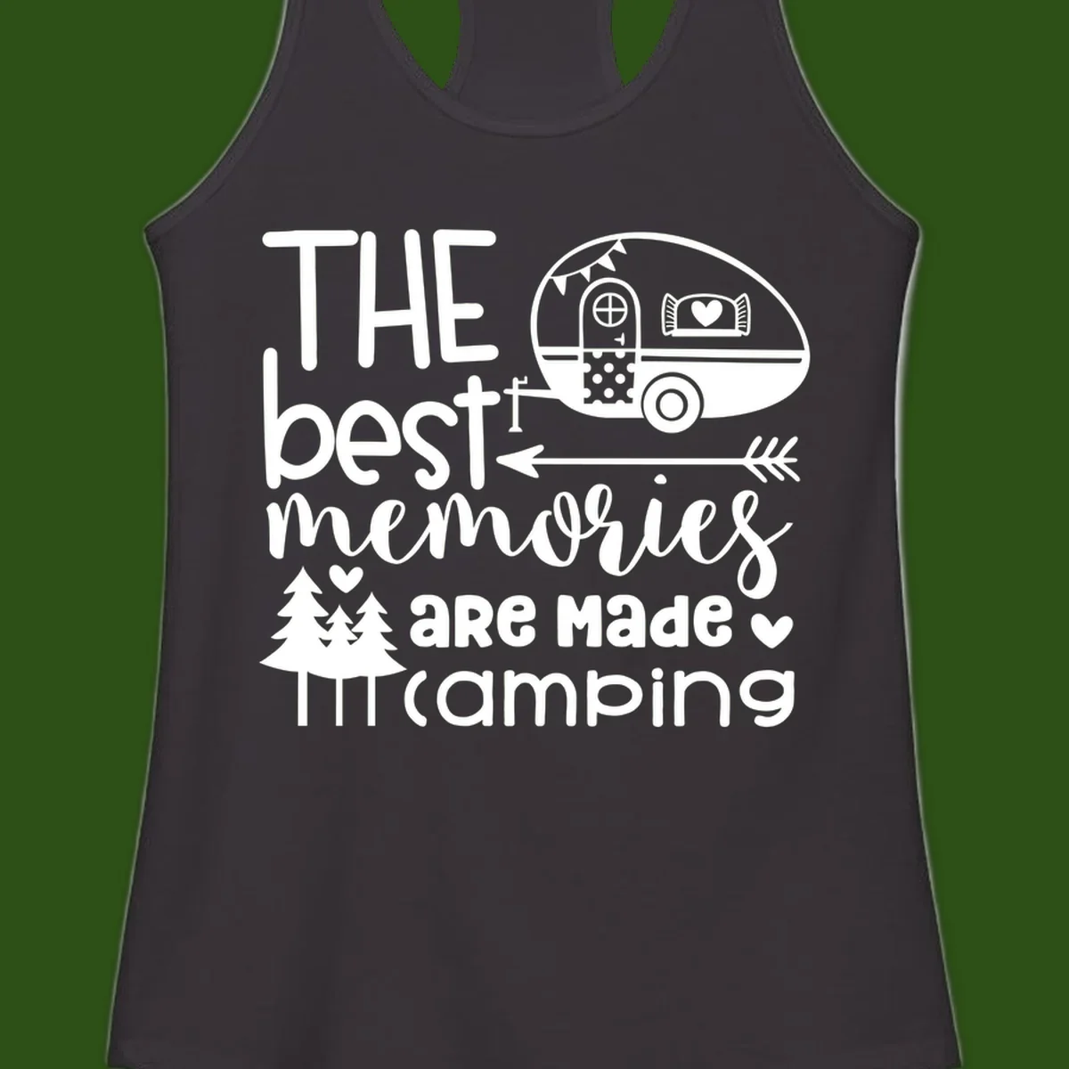 Vintage travel trailer with decorative text reading 'The best memories are made camping' surrounded by pine trees and hearts on gray background.