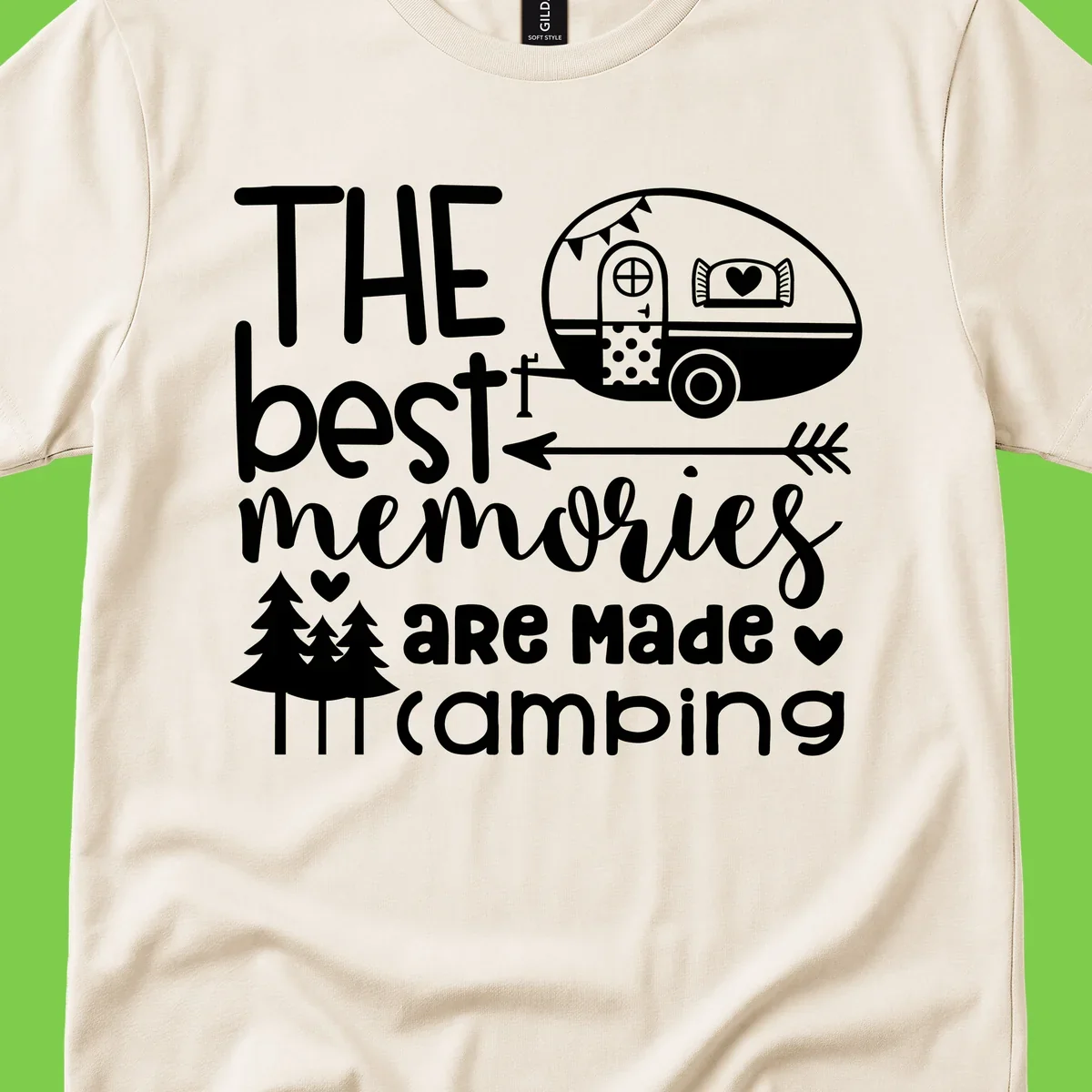 Vintage travel trailer with decorative text reading 'The best memories are made camping' surrounded by pine trees and hearts on gray background.