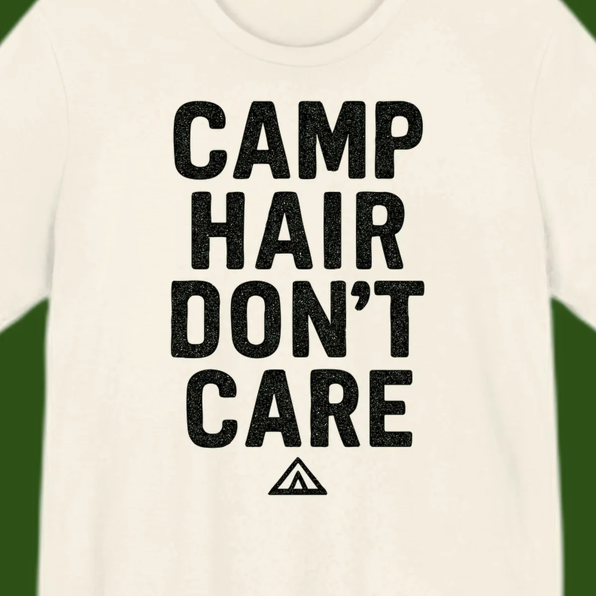 White speckled text reading 'Camp Hair Don't Care' with triangle symbol on gray background