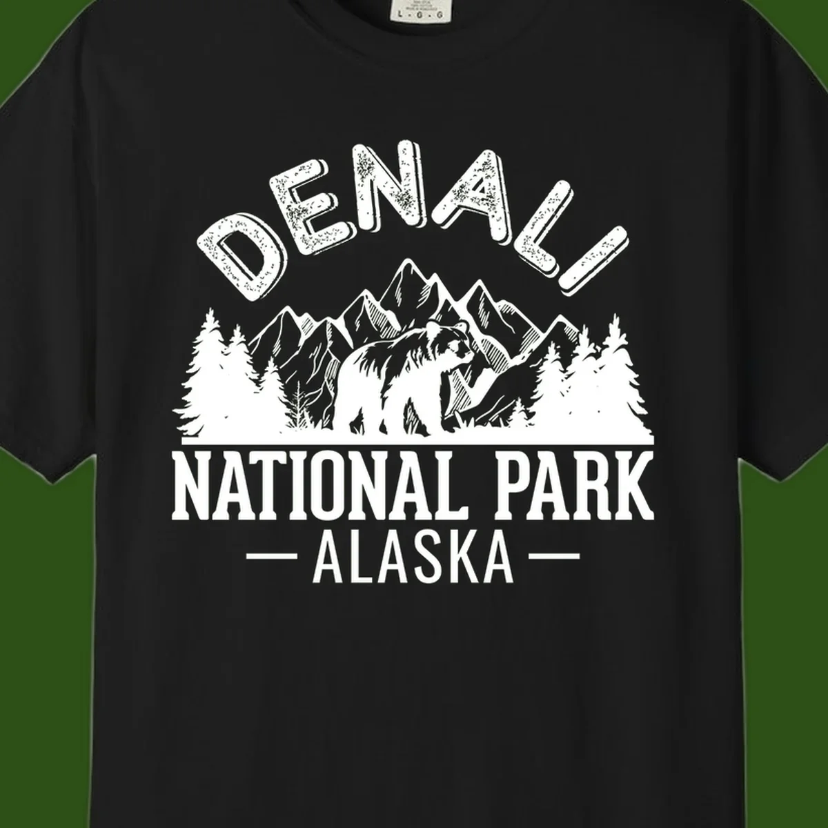 Denali National Park bear design with mountains, evergreen trees, and distressed white text on gray background