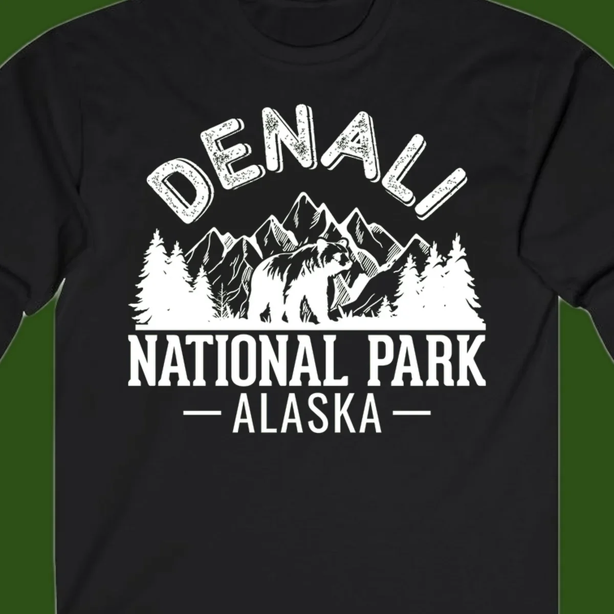 Denali National Park bear design with mountains, evergreen trees, and distressed white text on gray background