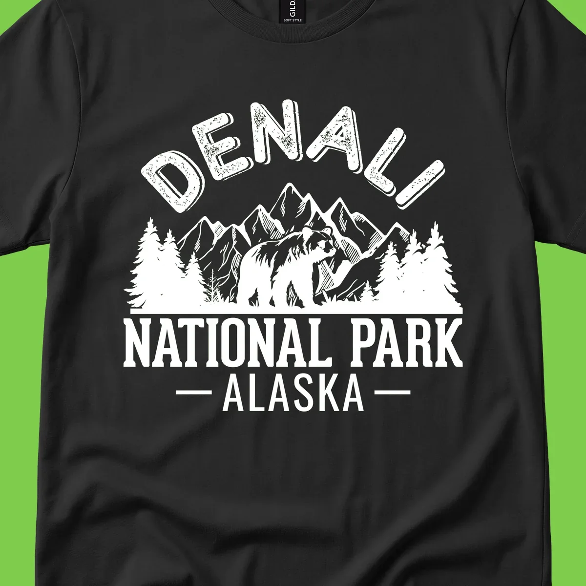 Denali National Park bear design with mountains, evergreen trees, and distressed white text on gray background