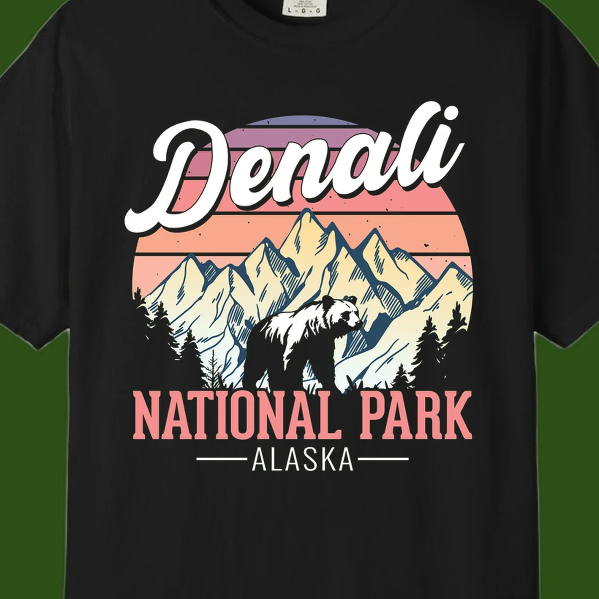 Vintage-style Denali National Park illustration featuring a bear in snowy mountains with retro sunset stripes and evergreen trees