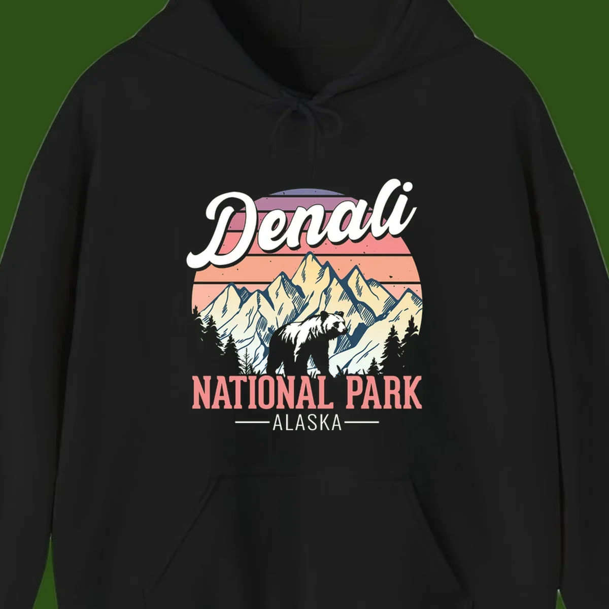 Vintage-style Denali National Park illustration featuring a bear in snowy mountains with retro sunset stripes and evergreen trees