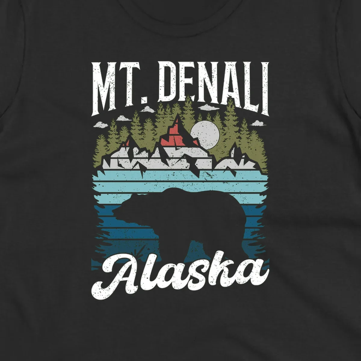 Denali bear Alaska design: layered illustration with silhouetted bear emerging from water, mountain peaks, fortress, forest, and full moon.