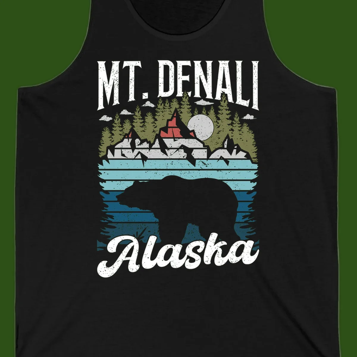 Denali bear Alaska design: layered illustration with silhouetted bear emerging from water, mountain peaks, fortress, forest, and full moon.