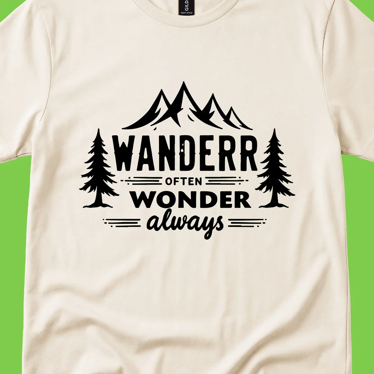 White illustration of snow-capped mountains and pine trees with text reading 'Wander Often Wonder Always' on gray background