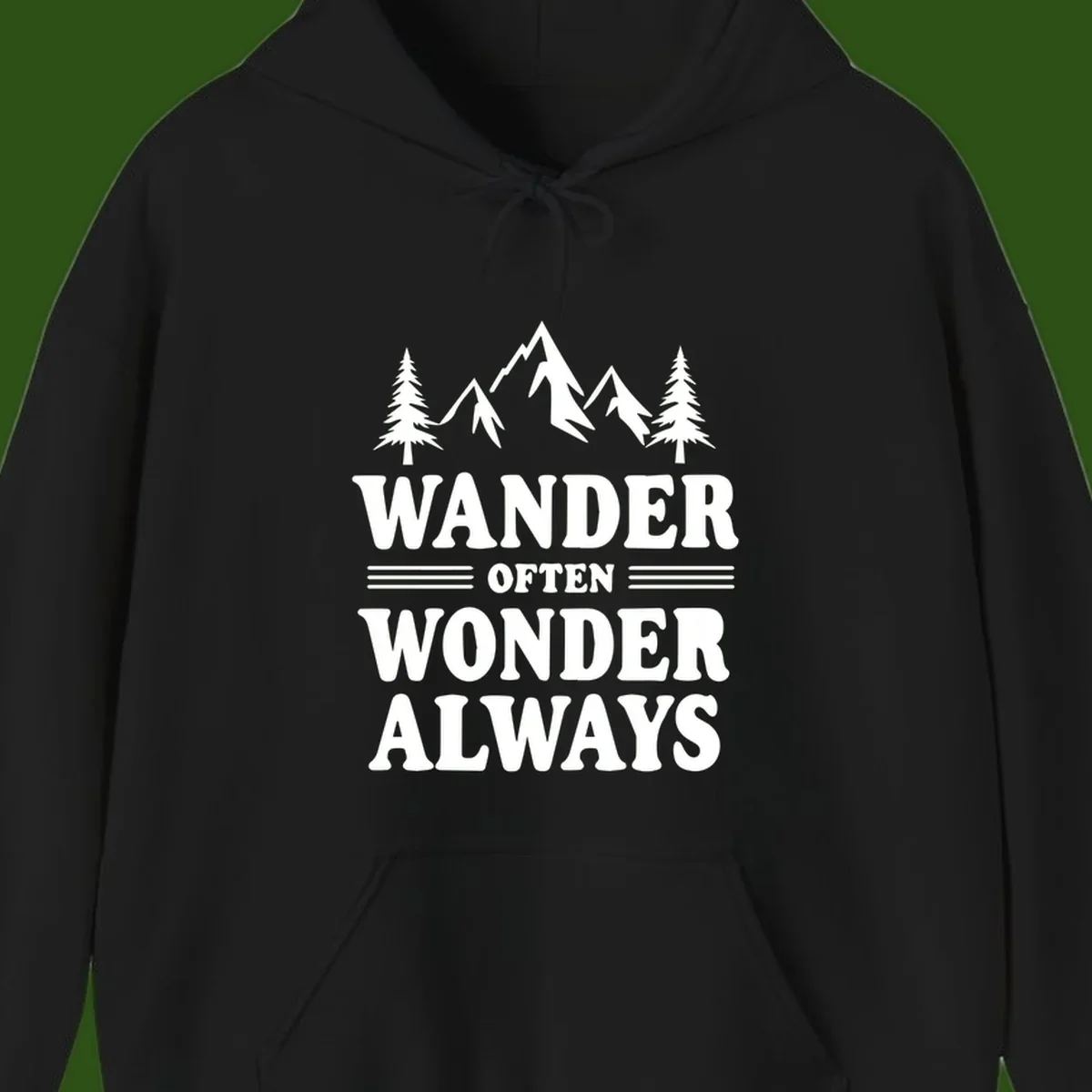 White mountain and evergreen tree illustration with 'Wander Often Wonder Always' text on gray background