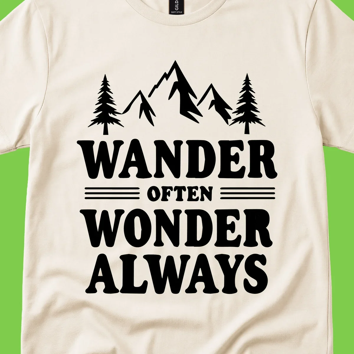 White mountain and evergreen tree illustration with 'Wander Often Wonder Always' text on gray background