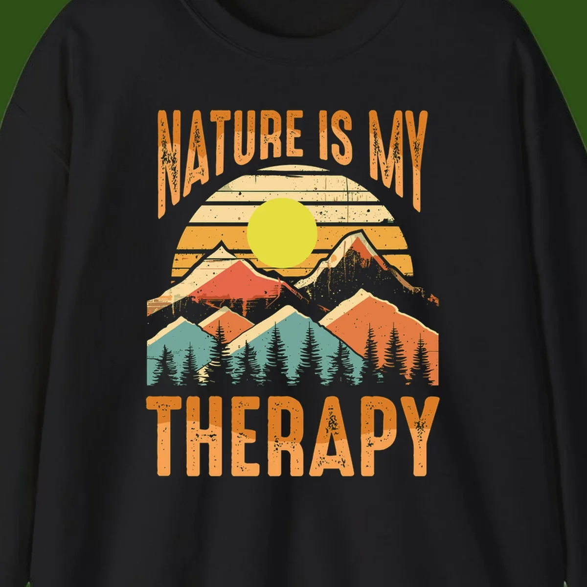 Vintage-style nature is my therapy design featuring layered mountains, sun, and forest with retro stripes and distressed texture