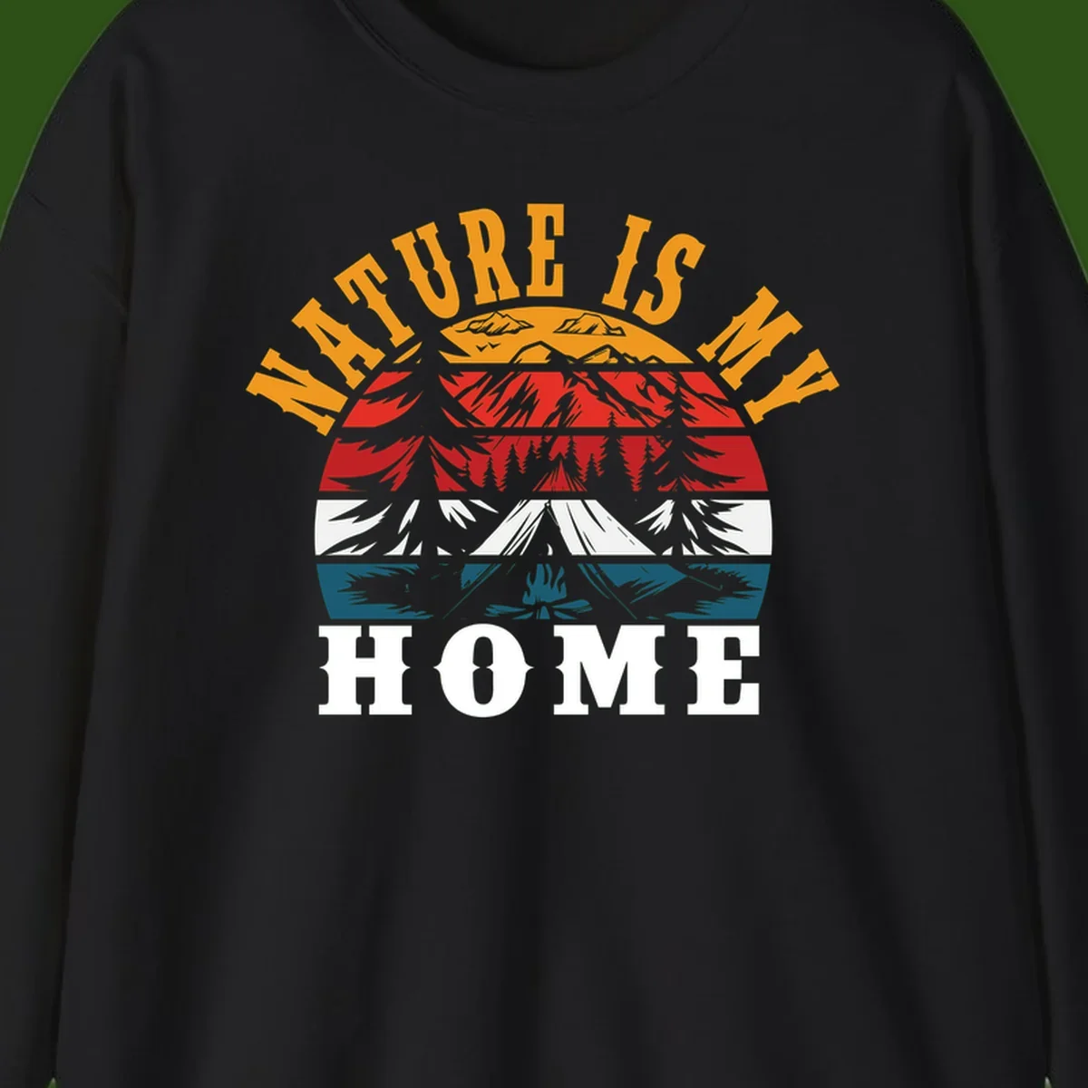 Nature Is Home mountain camping graphic with layered landscape, campfire, forest, and golden sun rays text design