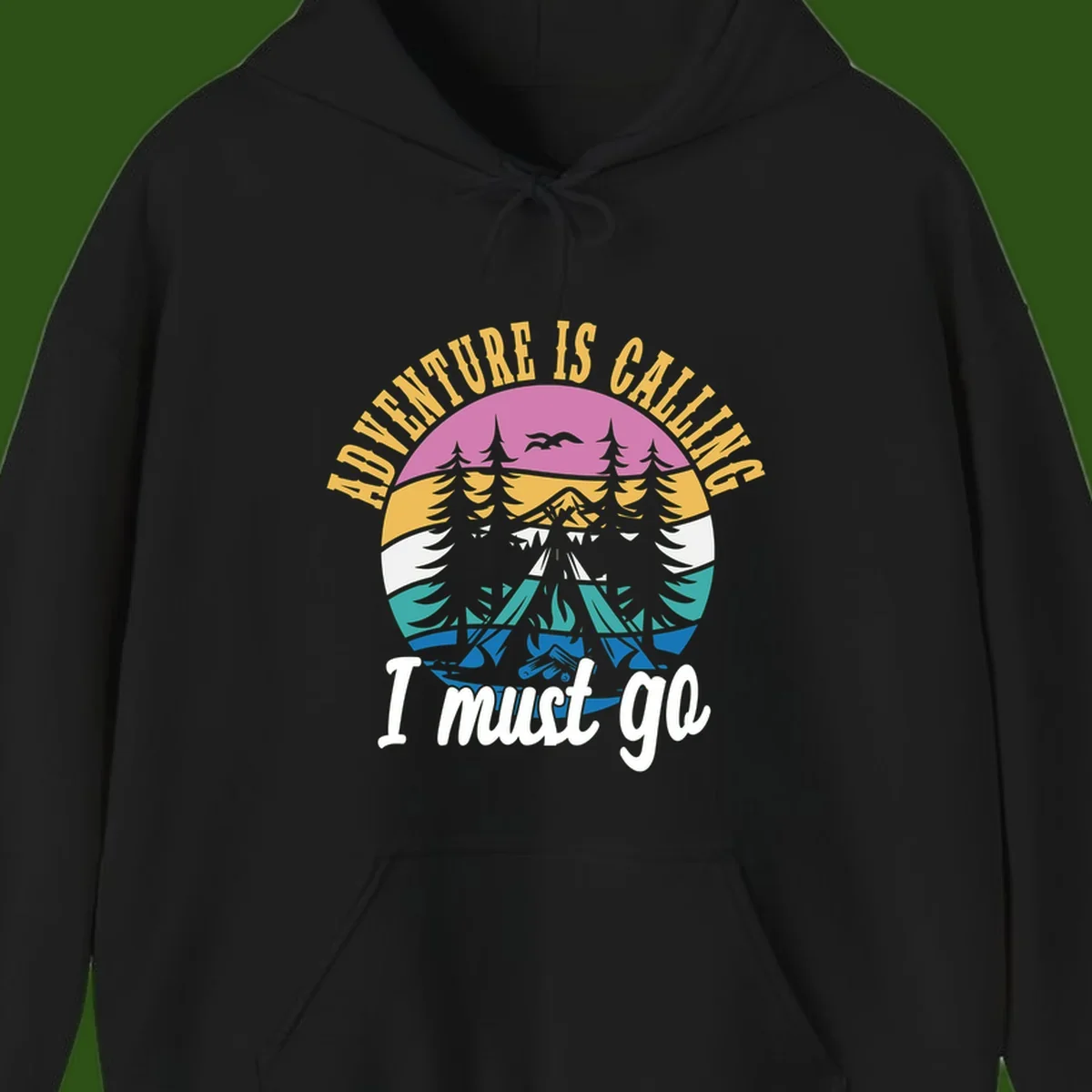 Circular badge with mountain landscape, evergreen trees, and flying birds in pink, gold, white, teal and blue with text 'Adventure Is Calling I Must Go'