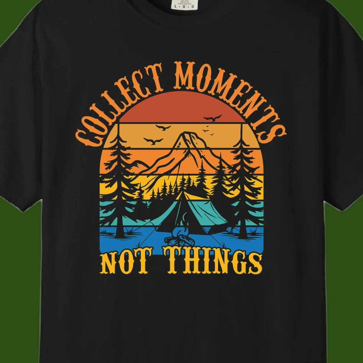 Retro layered landscape showing sunset, mountains, forest, tent and campfire with 'Quiet Mornings Not Things' text