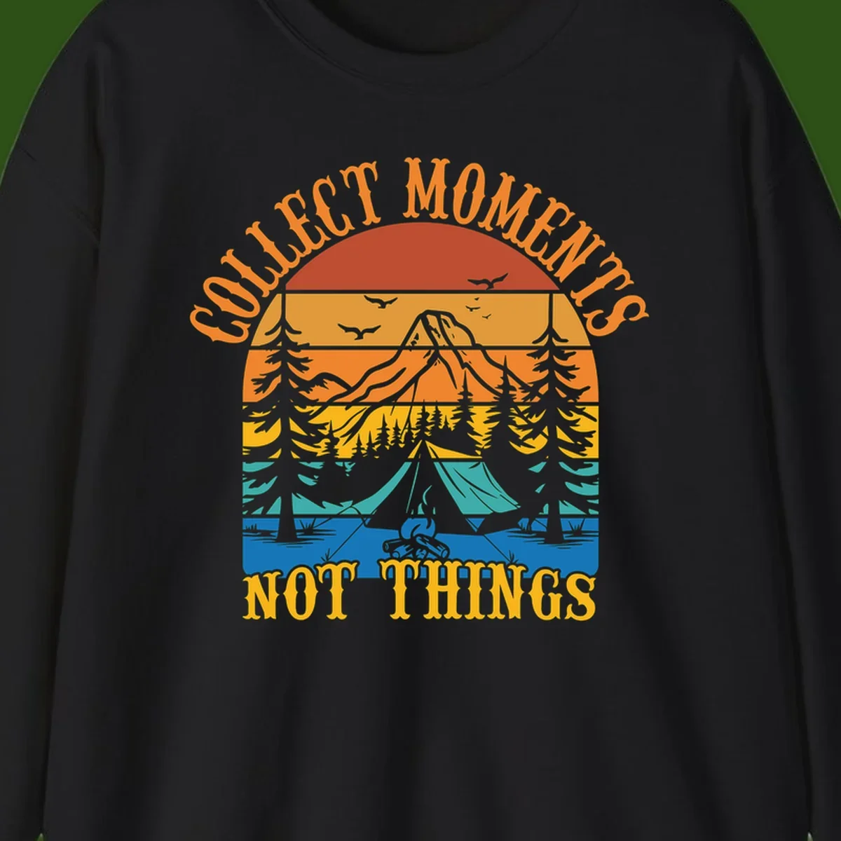 Retro layered landscape showing sunset, mountains, forest, tent and campfire with 'Quiet Mornings Not Things' text