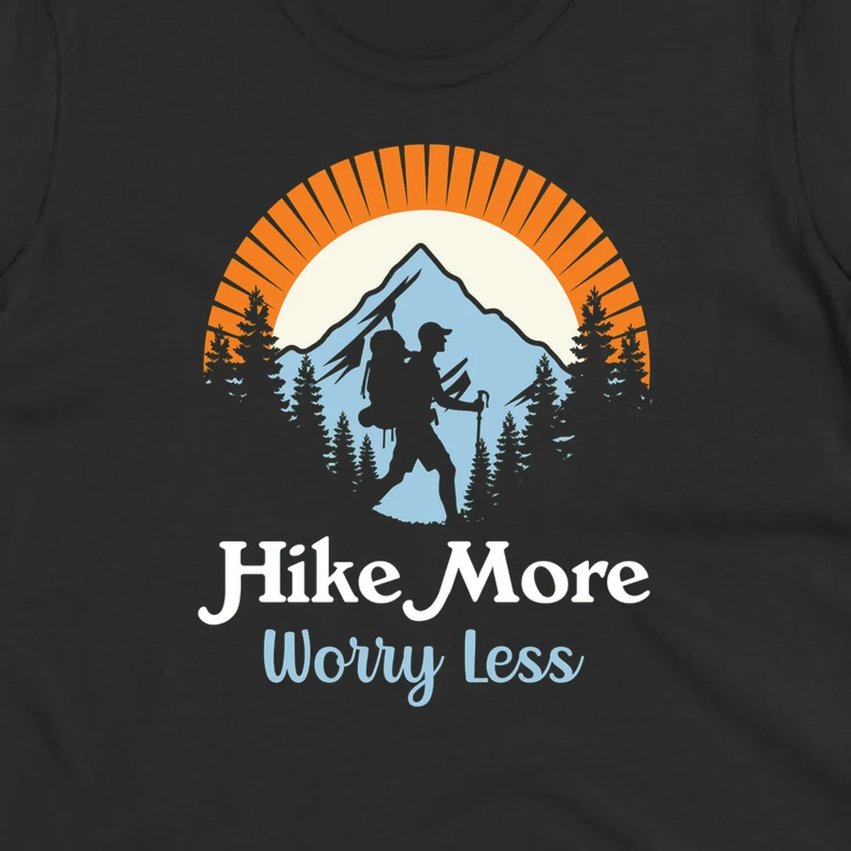 Hike more worry less badge design with silhouetted hiker, mountain peak, and evergreen forest in circular composition.
