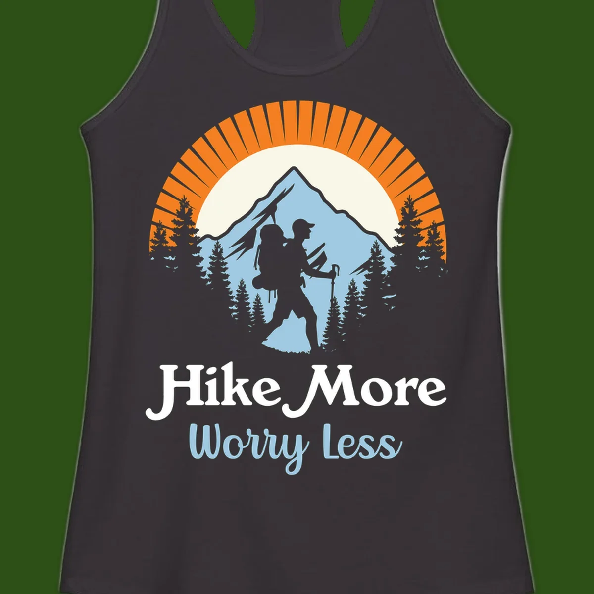Hike more worry less badge design with silhouetted hiker, mountain peak, and evergreen forest in circular composition.