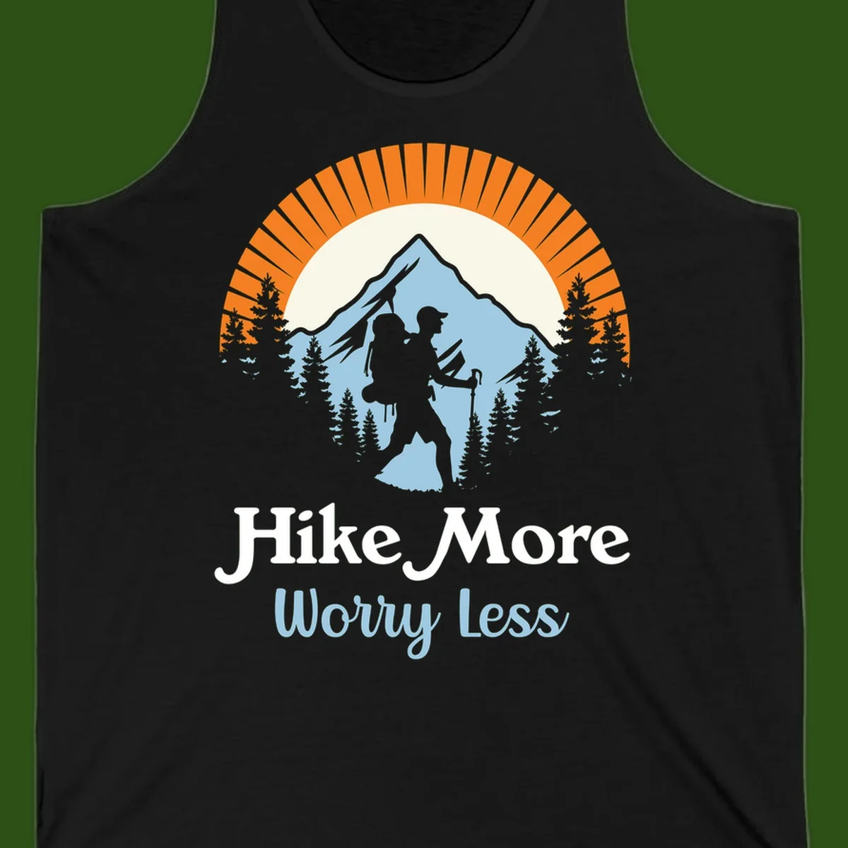 Hike more worry less badge design with silhouetted hiker, mountain peak, and evergreen forest in circular composition.