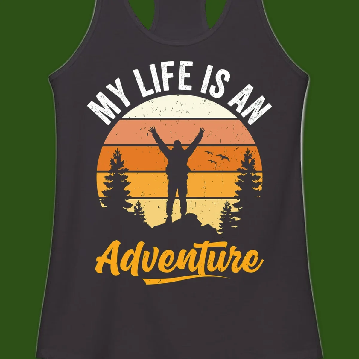 Retro sunset illustration with silhouette of person celebrating arms raised, evergreen trees and mountains, text 'My Life Is An Adventure'